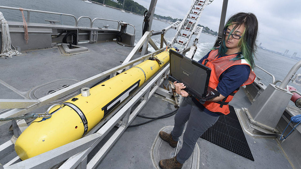 General Dynamics Employee with Bluefin-12 on Boat 