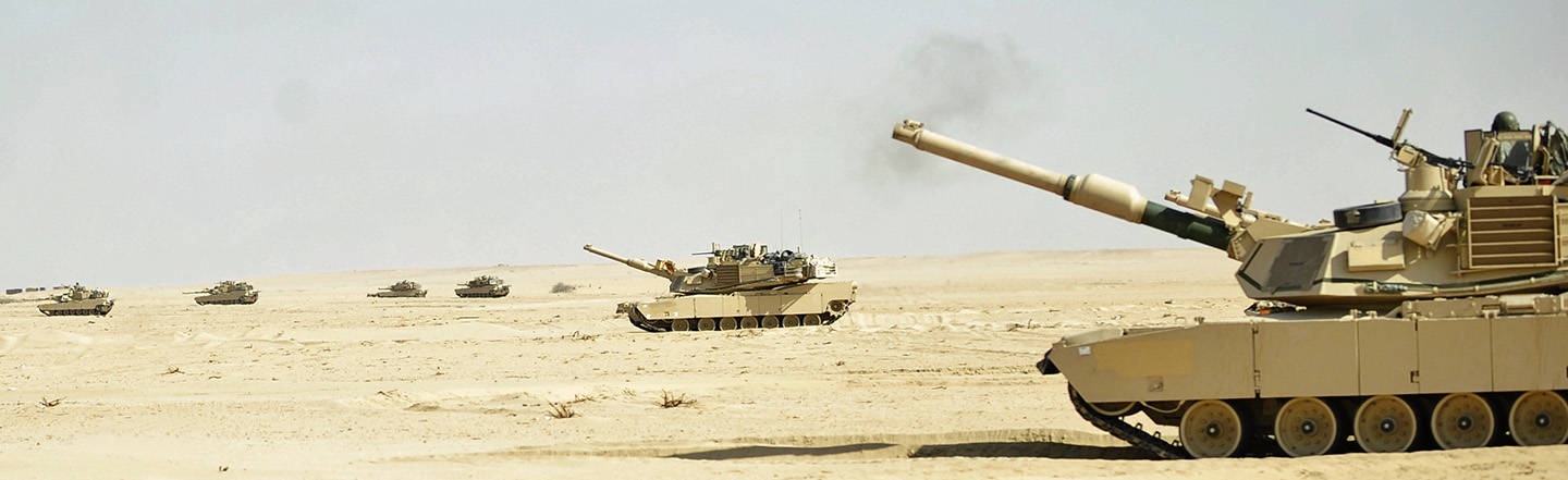 Abrams Main Battle Tanks Drive Across Desert
