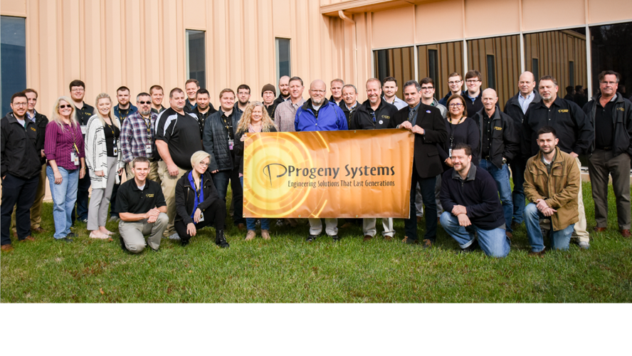 Progeny employees holding a sign