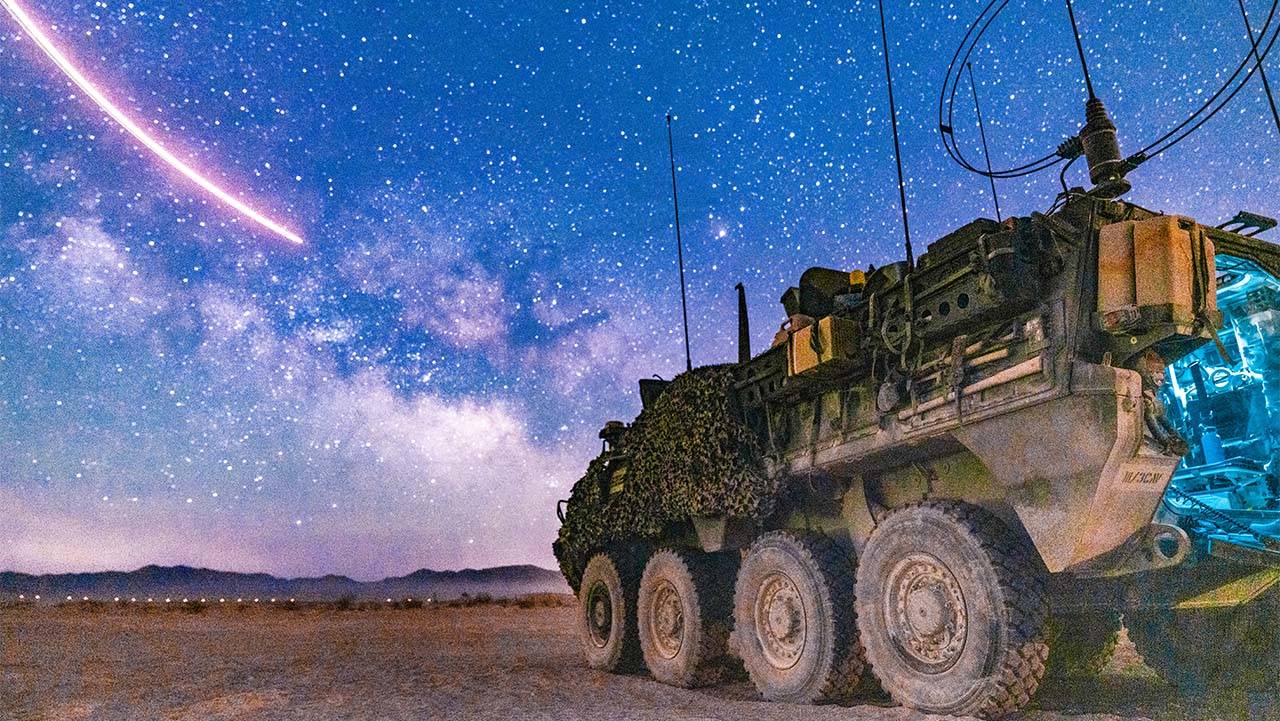 Stryker Parked with Stars in Background