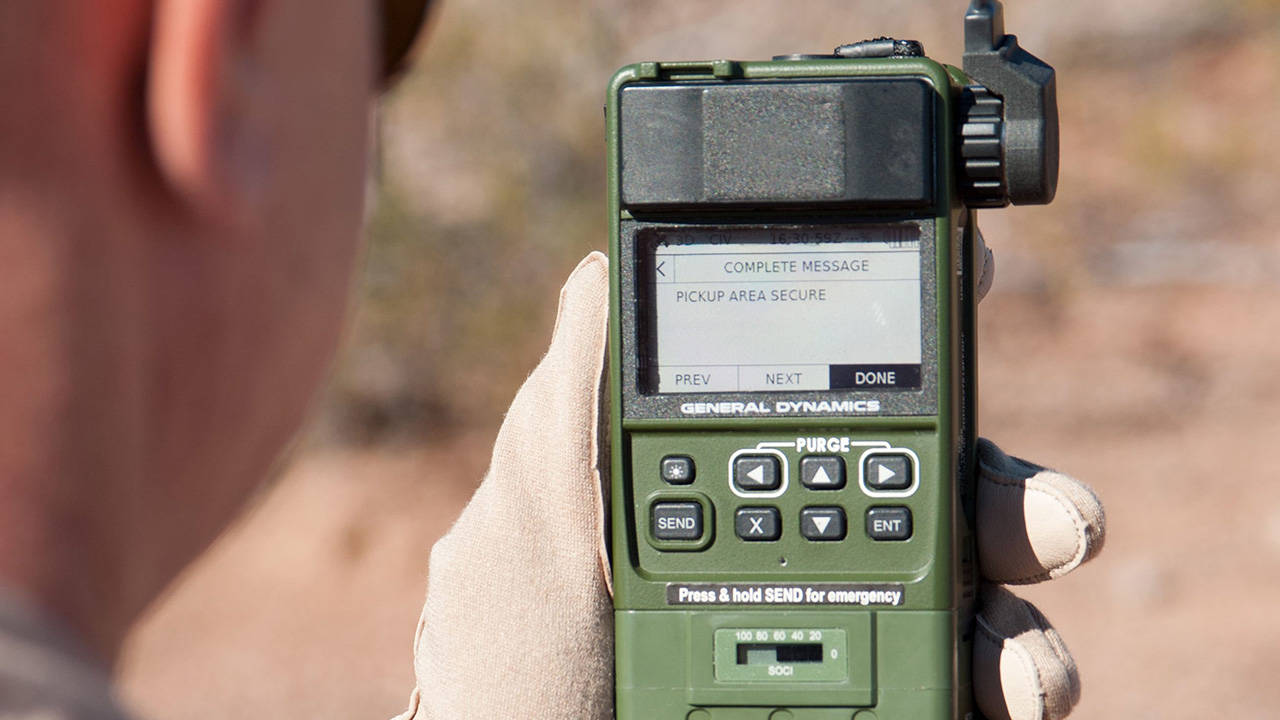 Pilot using General Dynamics HOOK3 Combat Survival Radio