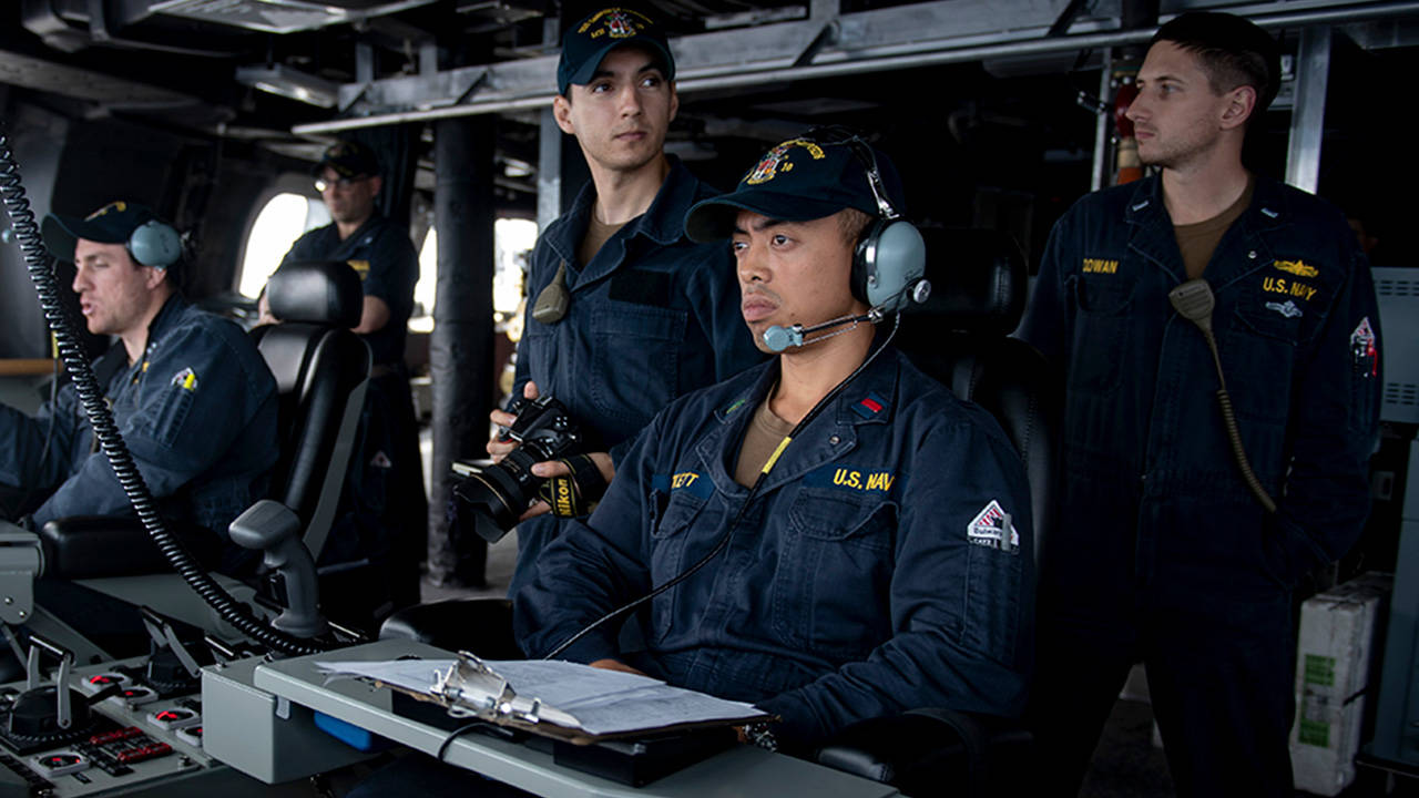 Sailors in the bridge of the Independence variant littoral combat ship USS Gabrielle Giffords LCS 10