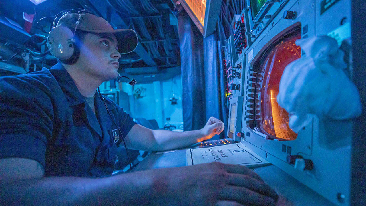 Sailor Monitors Surface Contacts aboard destroyer USS John McCain DDG 56
