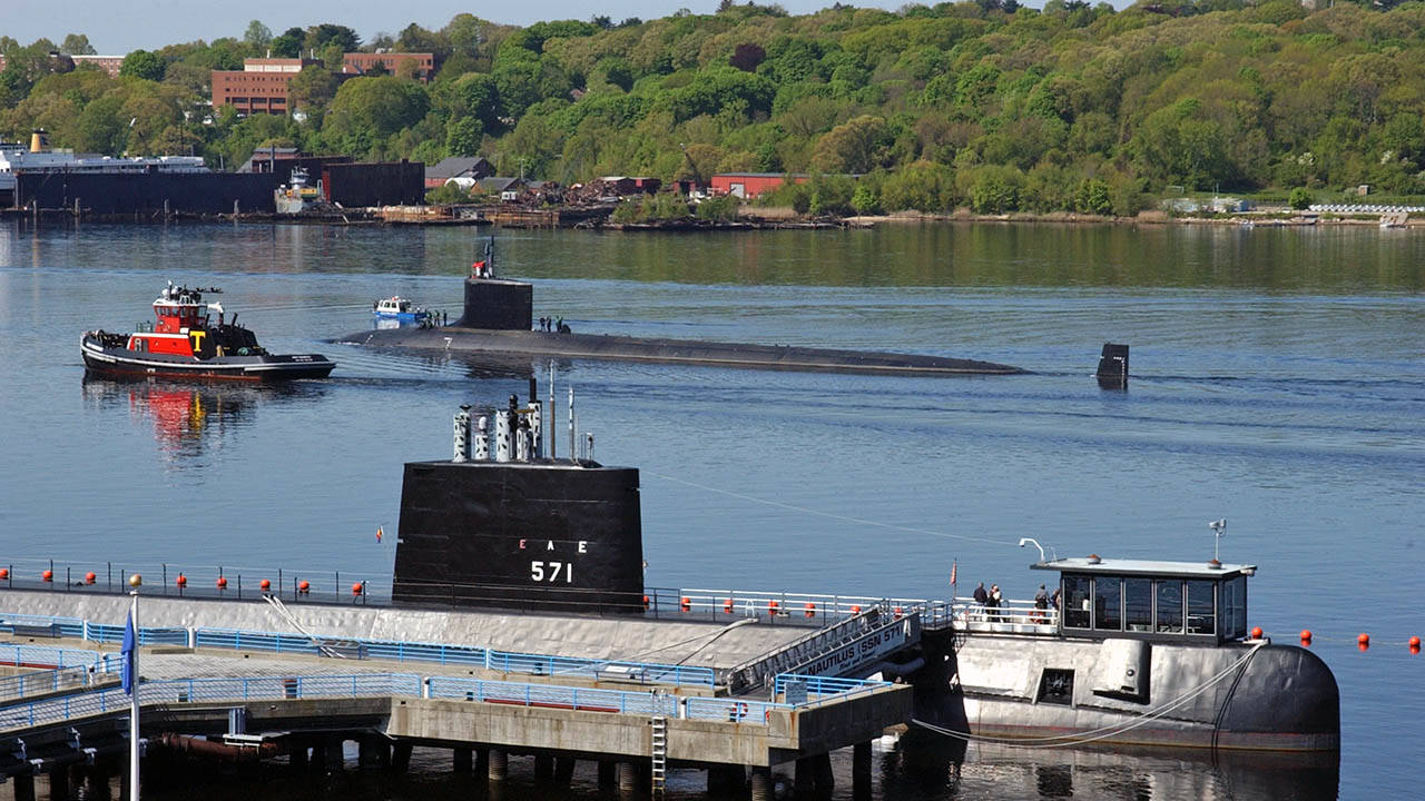 Virginia-class attack submarine USS Hawaii passes historic ship Nautilus