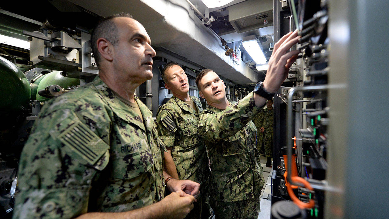 Sailor demonstrates the torpedo system aboard USS John Warner SSN 785 Virginia-class Submarine