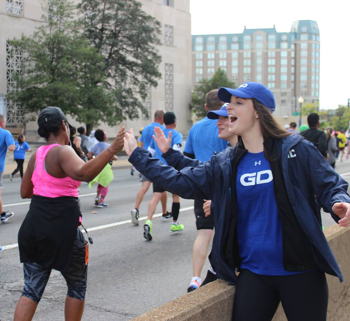 Army ten miler cheer squad high five
