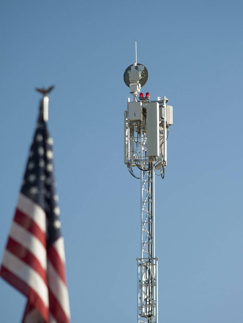 Cell on wheels with American flag