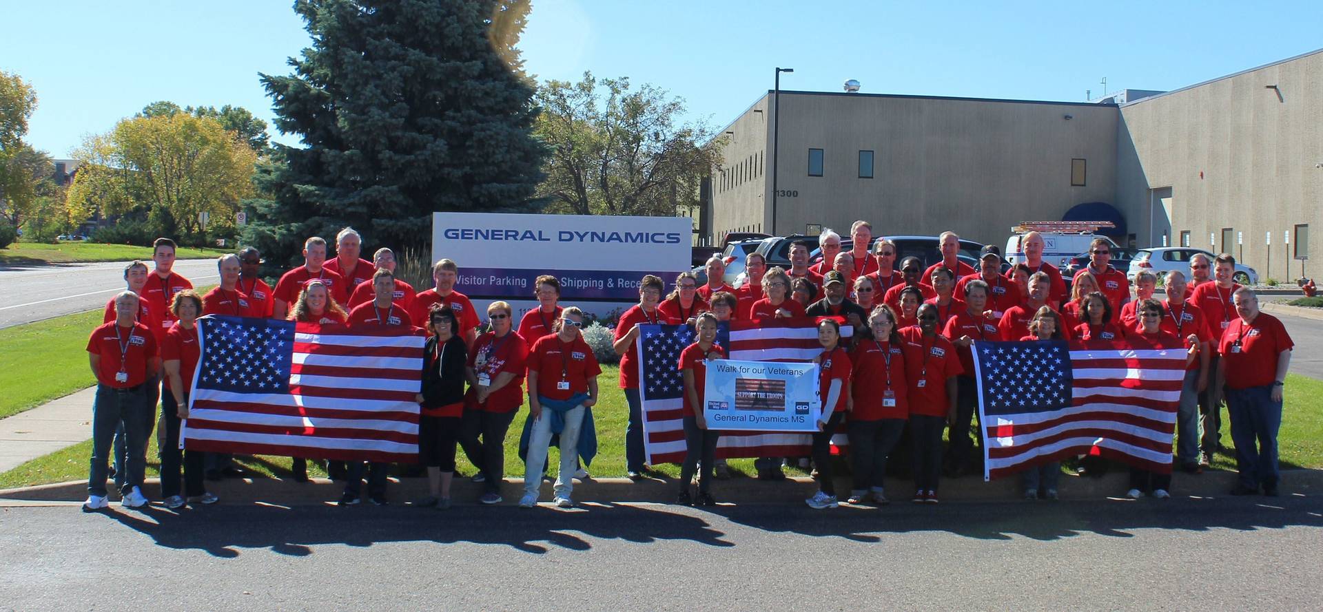 gd employees red shirt day team photo