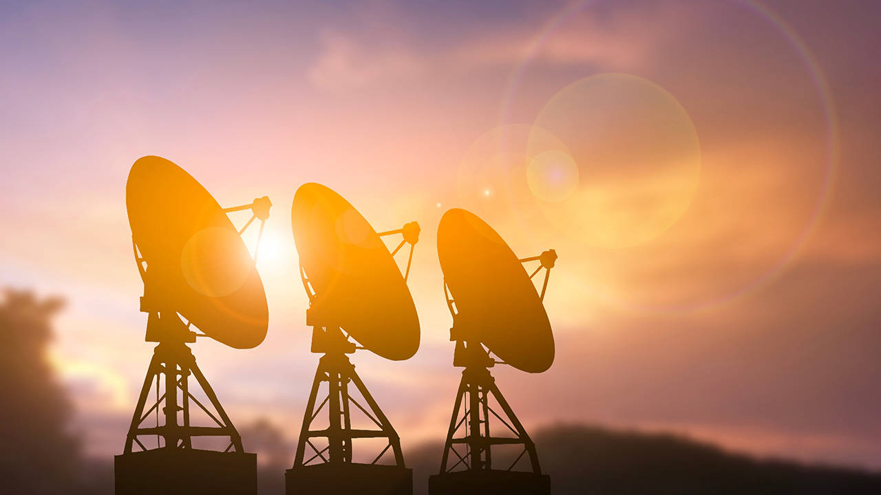 Three satellite radar dishes