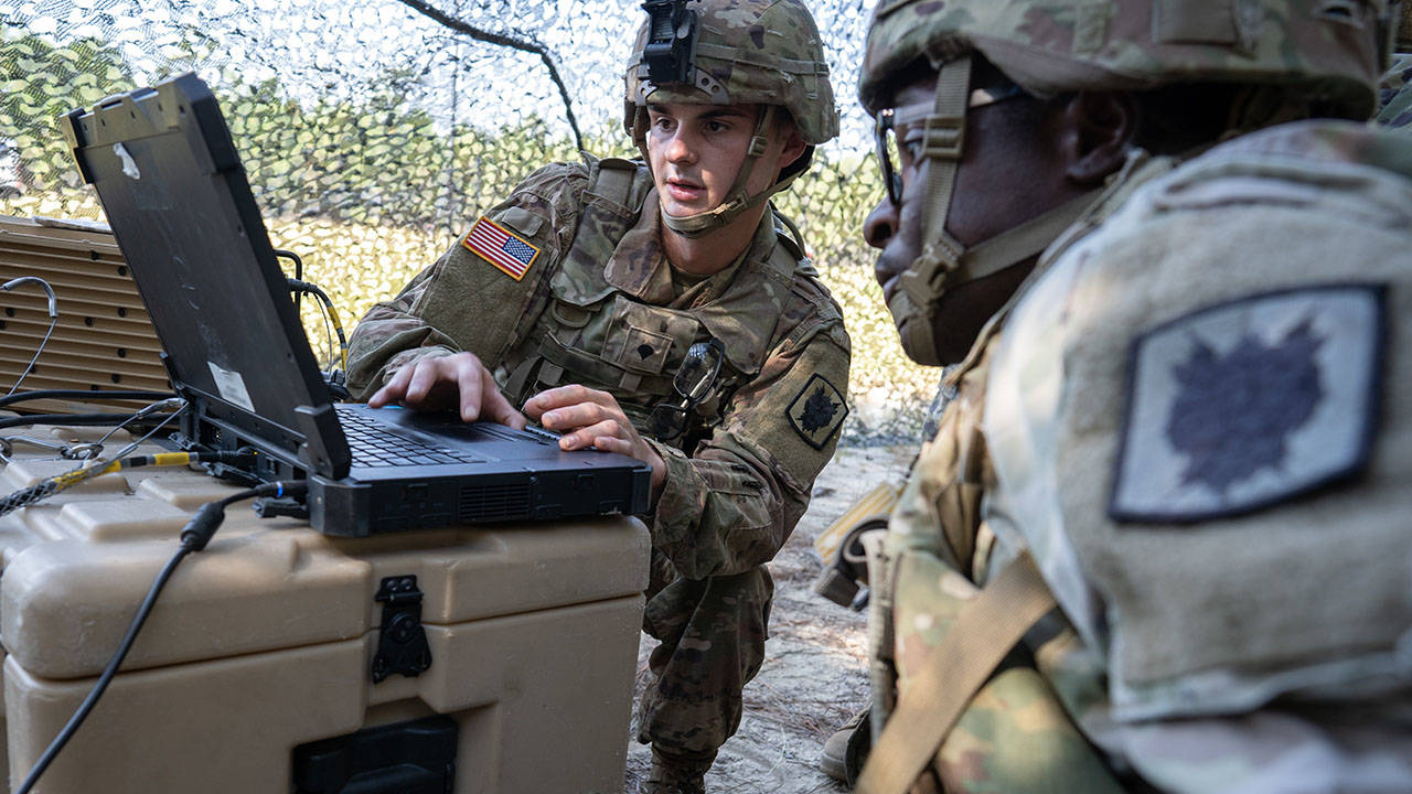 Army Soldiers Using Laptop Computer Intelligence